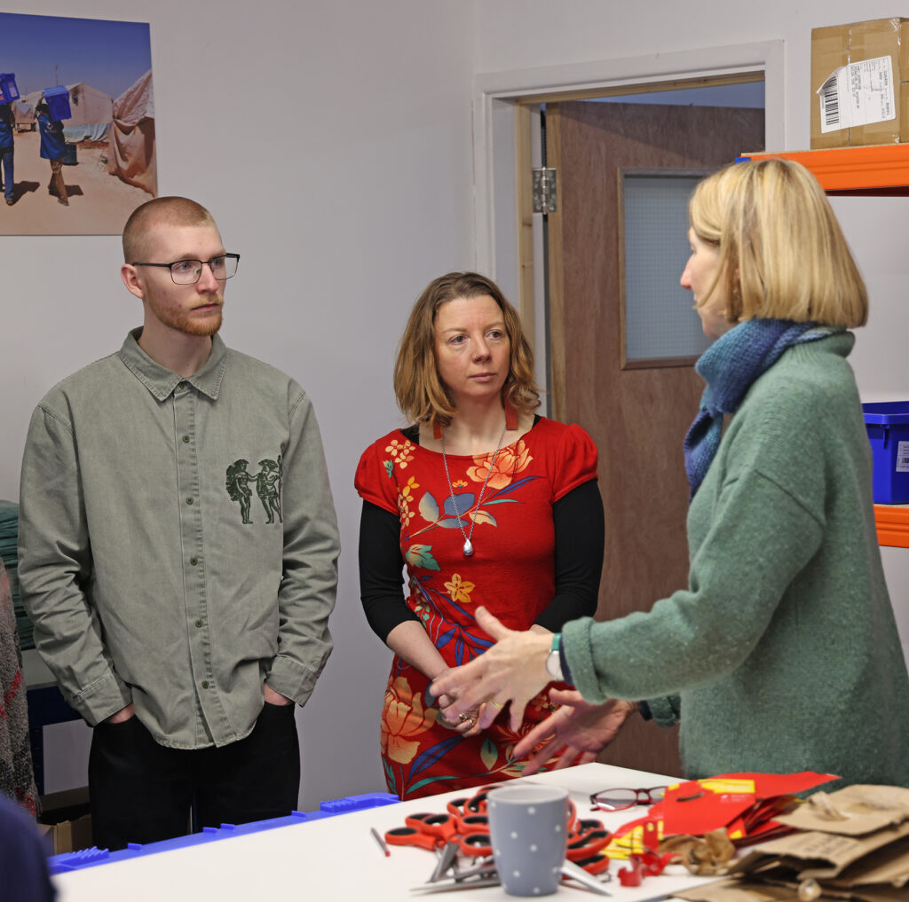 Peak Translations team at Aquabox in the Aqua-aid box packing room room 2